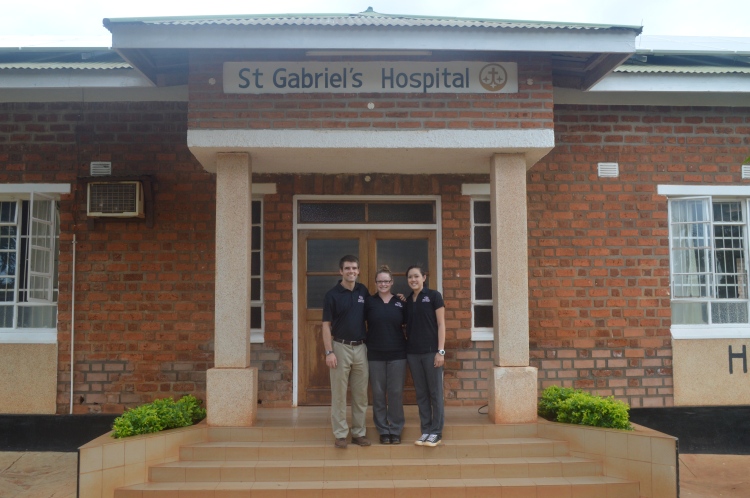 Mike, Mei and Katherine in front of St. Gabriel's Hospital.